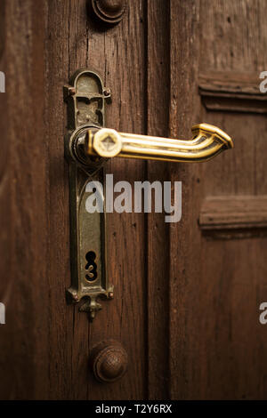 A keyhole shaped like a three in the wooden door to St Elizabeth's church in Bamberg, Germany. Stock Photo