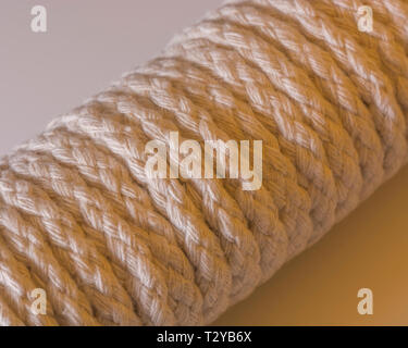 Close-up of a hank of natural multi-strand cotton cord - used for clotheslines and other jobs. Stock Photo