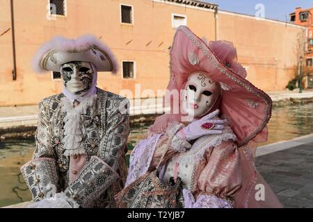 Pair with traditional Venetian masks, Carnival in Venice, Veneto, Italy Stock Photo