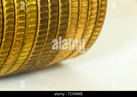 Macrophoto of a stack of coins. A stack of coins lies on its side. Side view . A good image for a site about finance, money, collection, relationships Stock Photo