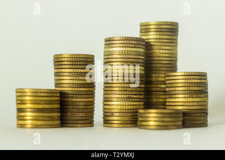Stacks of copper coins on a white background.  A good image for a site about finance, money, collection, relationships. Stock Photo