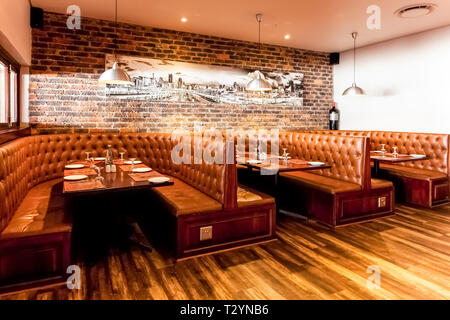 Johannesburg, South Africa - August 07 2013: Interior of Booth Style Restaurant Diner with Brown Interior Stock Photo