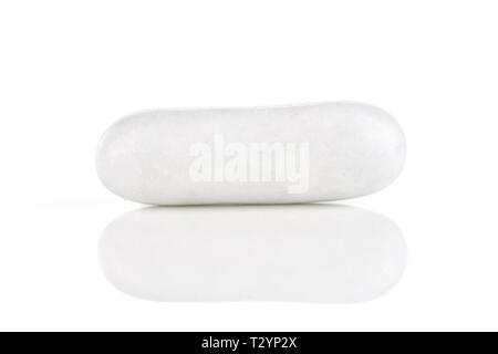 One whole white sweet licorice comfit isolated on white background Stock Photo