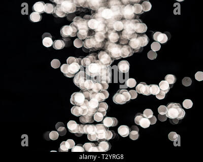 Dark background with white lense flairs. Bokeh balls. flat lay Stock Photo