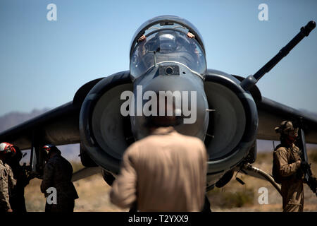 A U.S. Marine Corps AV-8B Harrier II Plus aircraft assigned to Marine Aviation Weapons and Tactics Squadron One (MAWTS-1) awaits refueling in support of a forward arming and refueling point exercise during Weapons and Tactics Instructor (WTI) course 2-19 in Yuma, Arizona, March 29, 2019. WTI is a seven-week training event hosted by MAWTS-1, which emphasizes operational integration of the six functions of Marine Corps aviation in support of a Marine Air Ground Task Force. WTI also provides standardized advanced tactical training and certification of unit instructor qualifications to support Mar Stock Photo