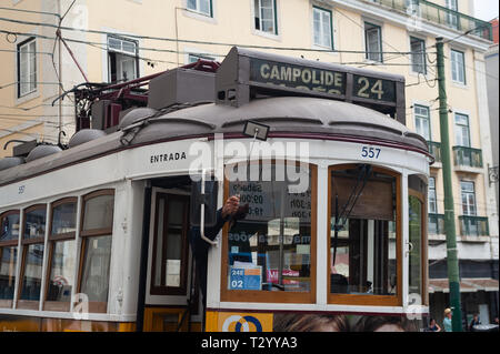 10.06.2018, Lisbon, Portugal, Europe - A tram driver uses a small mirror to adjust the destination display of his tram. Stock Photo