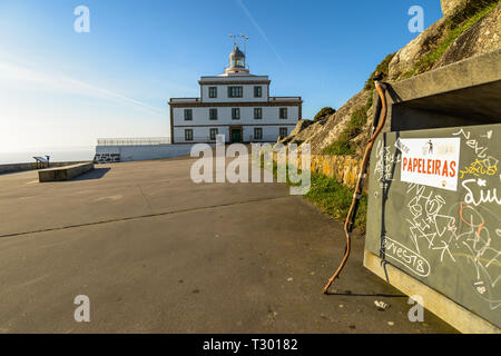 A walking stick outside lighthouse at the end of the camino de santiago Stock Photo