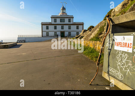 A walking stick outside lighthouse at the end of the camino de santiago Stock Photo