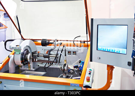 Machine for balancing the shaft of the turbocharger with monitor Stock Photo