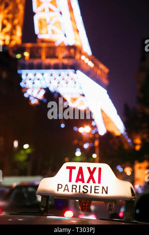 Taxi cab sign and Eiffel Tower, Paris, France. Taxi cab sign and Eiffel Tower, Paris, France.