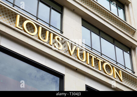 PARIS, FRANCE - JULY 22, 2017: Louis Vuitton fashion luxury store golden sign in Paris, France. Stock Photo