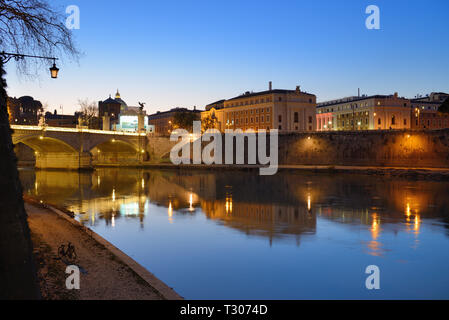 Reflections at Twilight or Dusk on River Tiber with Townscape of Rome, Ponte Vittorio Emanuele II Bridge, and City Skyline, Rome Italy Stock Photo