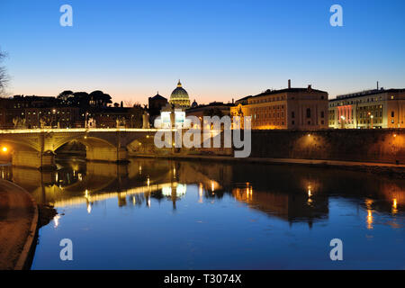 Reflections at Twilight or Dusk on River Tiber with Townscape of Rome, Ponte Vittorio Emanuele II Bridge, and City Skyline, Rome Italy Stock Photo