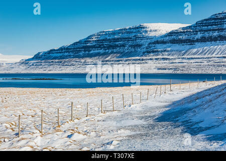 Dramatic winter landscape along Ísafjarðardjúp fjord near Ísafjörður in the Westfjords region, Iceland Stock Photo