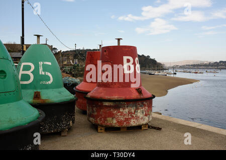 Navigation buoys, starboard, green lateral mark and port, red lateral mark on quayside for maintenance in Conwy north wales uk Stock Photo