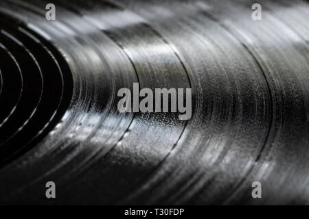 Surface of an old vinyl record. Macro shot, shallow depth of field. Stock Photo