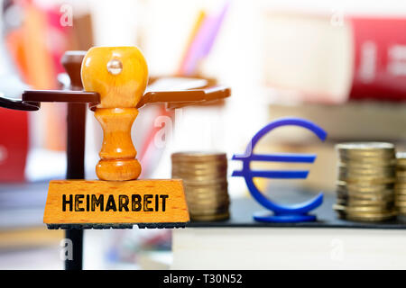 PHOTOMONTAGE, stamp with the label Home work, FOTOMONTAGE, Stempel mit der Aufschrift Heimarbeit Stock Photo