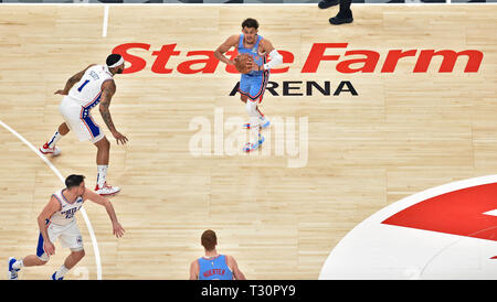 Atlanta, GA, USA. 3rd Apr, 2019. Atlanta Hawks guard Trae Young (top) looks to make a pass during the second quarter of a NBA basketball game against the Philadelphia 76ers at State Farm Arena in Atlanta, GA. Austin McAfee/CSM/Alamy Live News Stock Photo