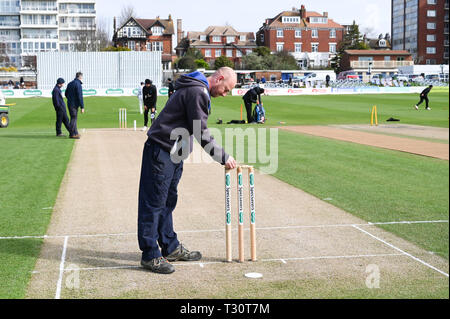Hove Sussex, UK. 05th Apr, 2019. One of the Sussex groundsmen Marc Gravett prepares the stumps on his last day working at the club before the Specasavers County Championship Division Two match between Sussex and Leicestershire at the 1st Central County Ground in Hove on a sunny but cool first morning of the season Credit: Simon Dack/Alamy Live News Stock Photo