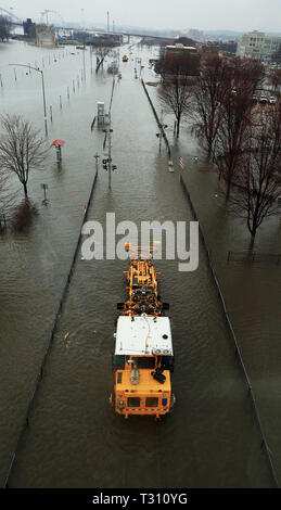 Davenport, Iowa, USA. 5th Apr, 2019. Canadian Pacific Railway employees run a railroad track tie replacement machine along a section of flooded track in LeClaire Park Thursday, April 4, 2019. Credit: Kevin E. Schmidt, Kschmidt@Qctim/Quad-City Times/ZUMA Wire/Alamy Live News Stock Photo