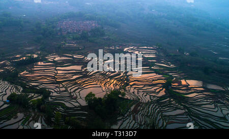 Beijing, China. 3rd Apr, 2019. Aerial photo taken on April 3, 2019 shows Hani terraced fields in Yuanyang County, southwest China's Yunnan Province. Credit: Hu Chao/Xinhua/Alamy Live News Stock Photo