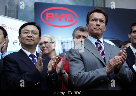 Beijing, China. 3rd Apr, 2019. File photo taken on April 30, 2010 shows Chinese automaker BYD Chairman Wang Chuanfu (L) and then California Governor Arnold Schwarzenegger (R) during a press conference at Los Angeles City Hall to announce that BYD will locate its North American headquarters in Los Angeles, the United States. China's leading electric vehicle maker BYD held a ceremony on April 3, 2019 to celebrate its 300th bus at its Lancaster manufacturing plant in the U.S. state of California, marking a milestone for production. Credit: Ringo H.W. Chiu/Xinhua/Alamy Live News Stock Photo