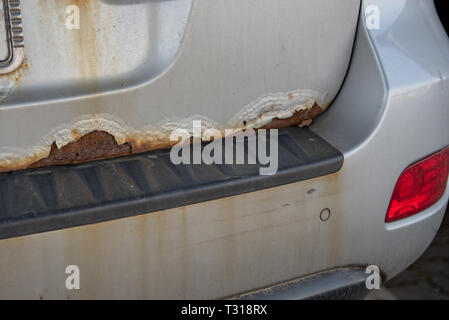 Old car with old rusty paint peeling off Stock Photo