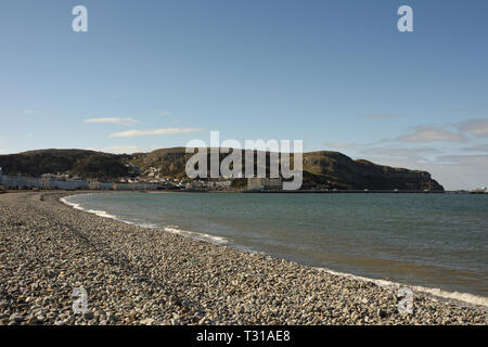 Shingle beach in Llandudno looking towards Great Orme in Conwy north wales uk Stock Photo