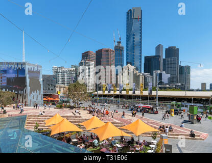 View over Federation Square towards the skyline of Southbank with the Eureka Tower in the centre, Melbourne, Australia Stock Photo