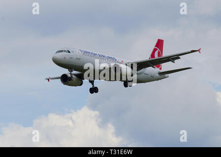 ST. PETERSBURG, RUSSIA - MAY 17, 2016: The Airbus A320-232 plane (TC-JPM) of Turkish Airlines flies in the cloudy sky Stock Photo