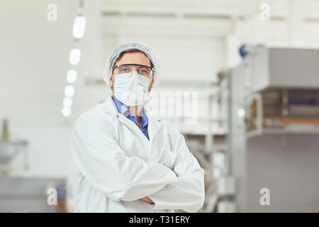 Chemist man in mask at work Stock Photo
