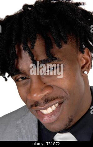 A happy African American mans face in a close up image with his fussy black hair in a suit, isolated for white background Stock Photo