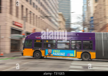 Camera panning of a moving trolley bus in downtown Seattle, Washington, United States Stock Photo