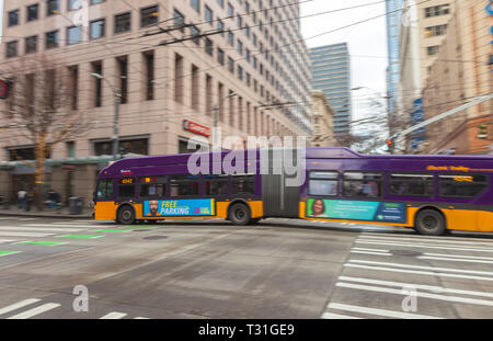 Camera panning of a moving trolley bus in downtown Seattle, Washington, United States Stock Photo