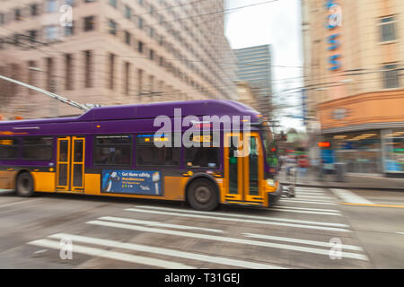 Camera panning of a moving trolley bus in downtown Seattle, Washington, United States Stock Photo