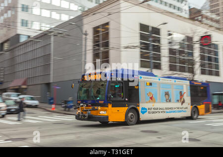 Camera panning of a moving trolley bus in downtown Seattle, Washington, United States Stock Photo