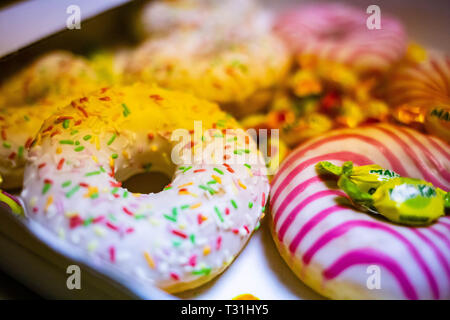 Colored tasty donuts close up sugar food dessert Stock Photo
