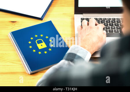 GDPR (General Data Protection Regulation) concept. Business man typing an email with laptop. Notebook with European Union (EU) flag logo and lock icon. Stock Photo