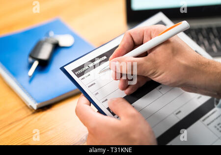Car insurance form, bank loan, lease agreement or repair contract. Man writing personal information to document. Customer buying or salesman selling. Stock Photo