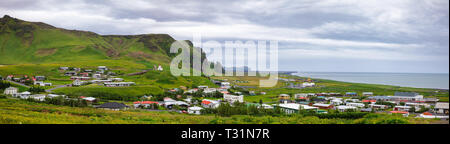Panoramic view of Vik i Myrdal, the southernmost village in Iceland and popular travel destination for basalt stacks Reynisdrangar, black sand beach a Stock Photo