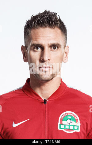 **EXCLUSIVE**Brazilian football player Olivio da Rosa, also known as Ivo, of Henan Jianye F.C. poses during the filming session of official portraits for the 2019 Chinese Football Association Super League, in Foshan city, east China's Guangdong province, 19 February 2019.