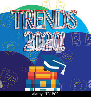 Writing note showing Trends 2020. Business concept for general direction in which something is developing next year Graduation Cap Tassel Resting on S Stock Photo