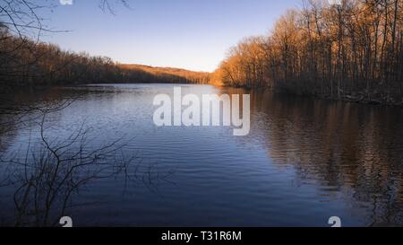 A peaceful lake location in nature for meditation and to get away from social media. Stock Photo