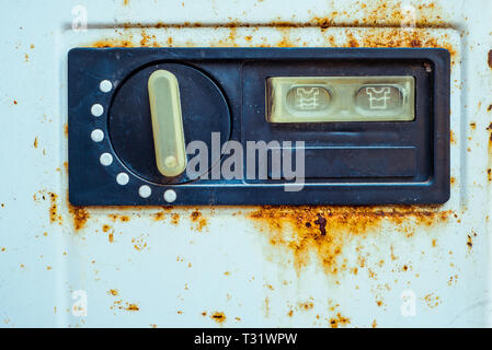 View on the old switch of the washing machine with rusty on edge. Soviet technic Stock Photo