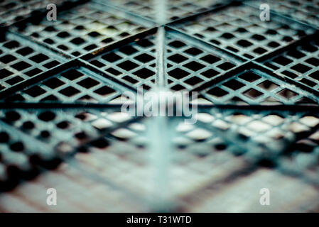 Plastic mesh, texture of black geometrical surface with depth of field. Abstract horizontal background. Stock Photo