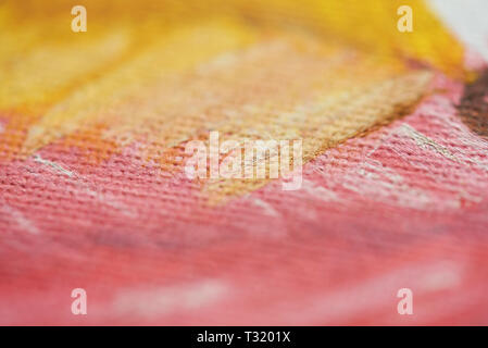 Yellow and pink paint on canvas paper background Stock Photo