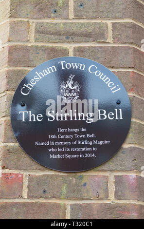 Plaque on the wall of the clock tower in Market Square, Chesham, commemorating the restoration of the 18th century town bell. Stock Photo