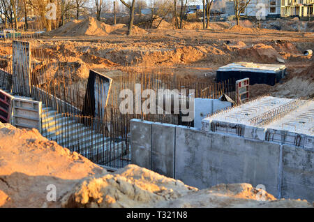 Monolithic concrete structure in the foundation pit during the construction of a new underground pedestrian crossing in the subway Stock Photo