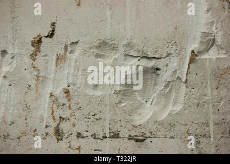 Gnarled old surface of plastered wall as background