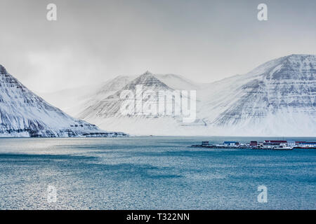 Dramatic winter landscape of Önundarfjörður fjord and mountains above Flateyri in the Westfjords region of Iceland Stock Photo